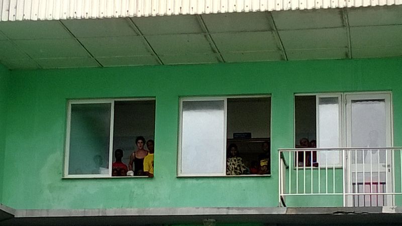 Kid watching the dancers from the children's ward