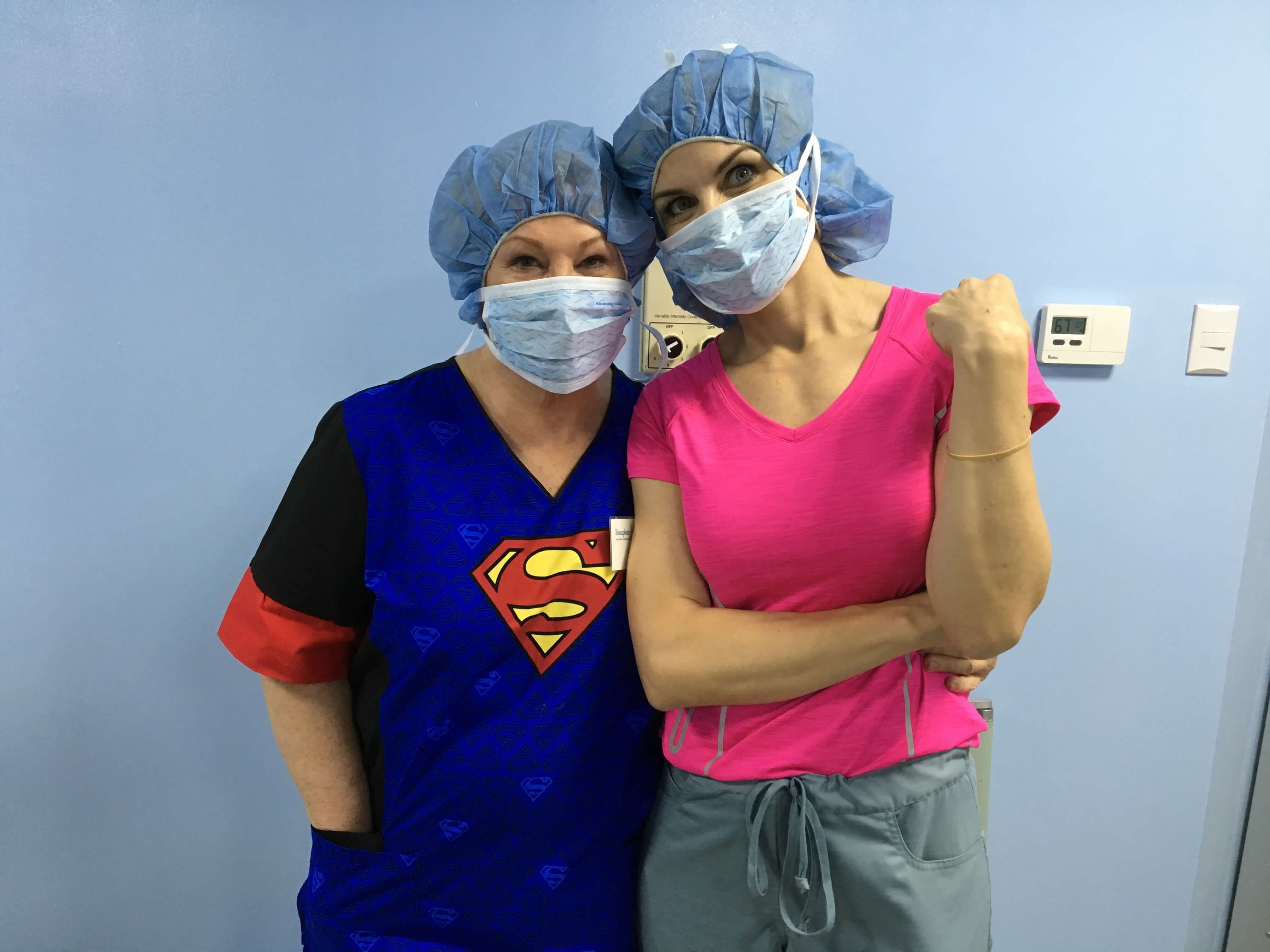 Mother Drinda Olsen and daughter Jill Hoyer observe a surgery.