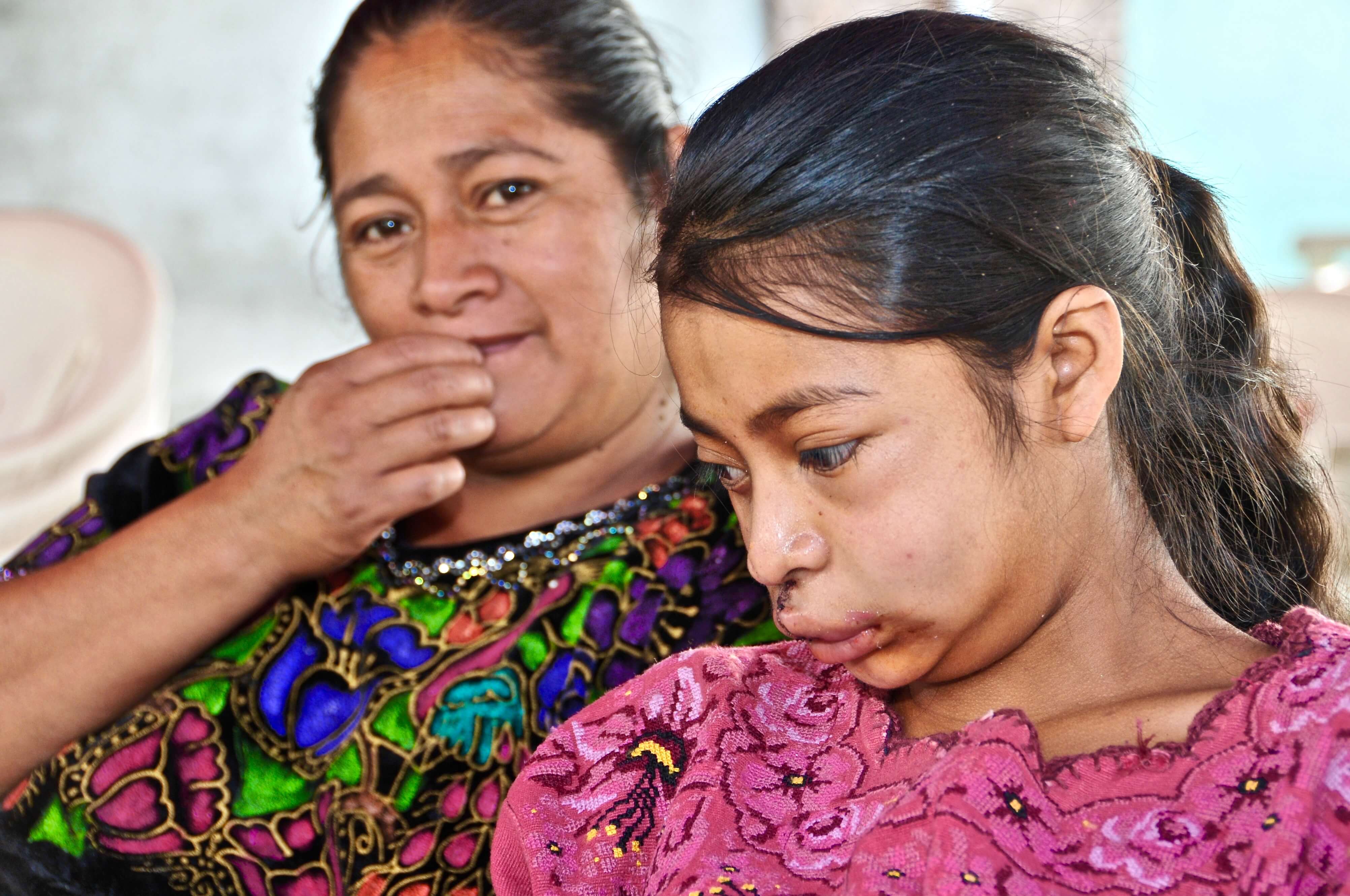 Angelica and her mom waiting to be seen by doctors a week after her surgery.